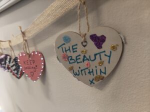 Heart decorated by a service user reads 'the beauty within'