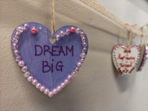A heart decoration at the centre reads 'dream big'
