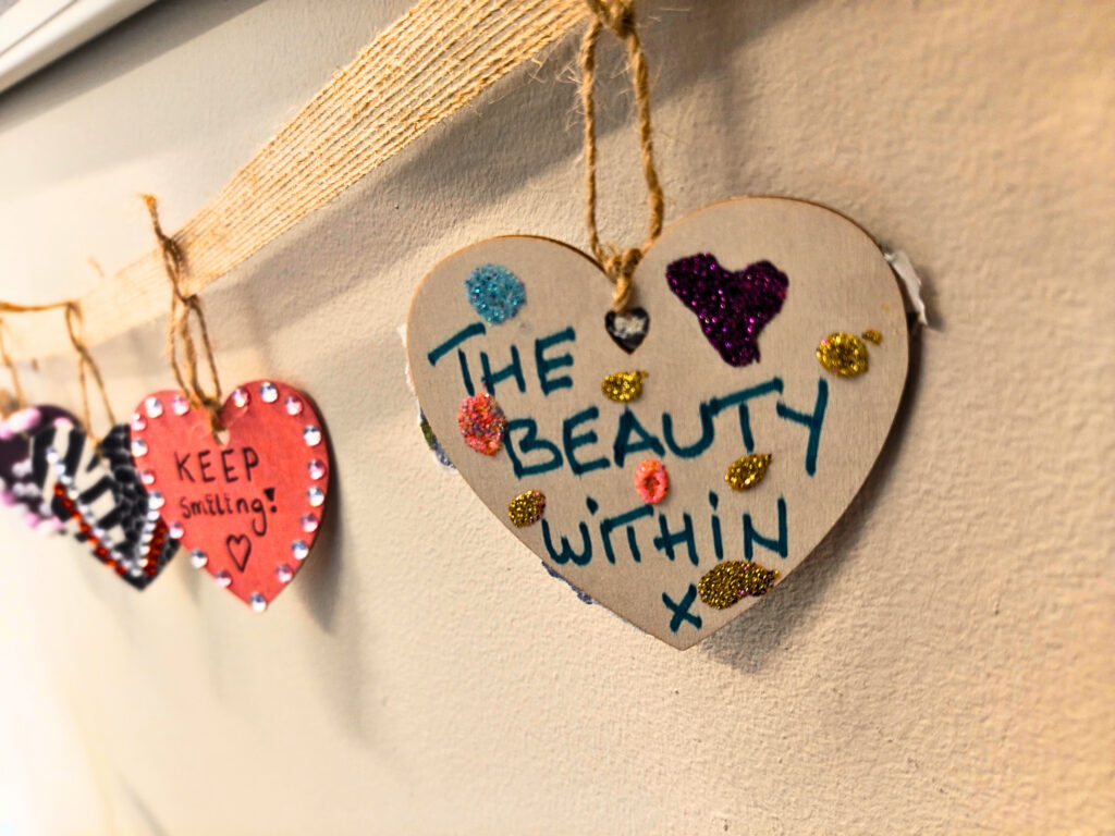 Heart decorated by a service user reads 'the beauty within'